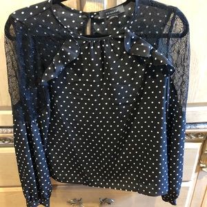 Polka-dot blouse with lace arm
